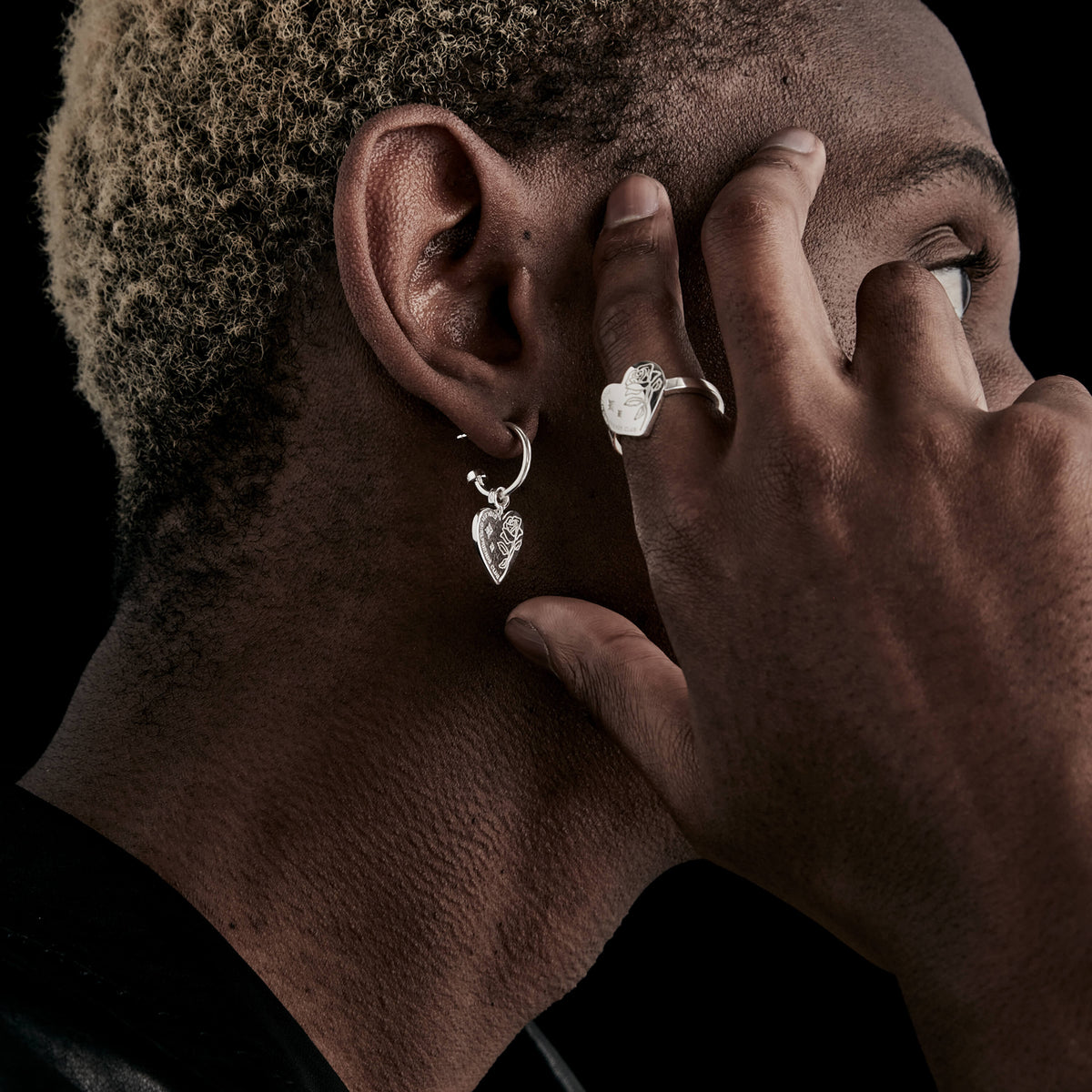 Male model wearing Stolen Girlfriends Club earring and ring